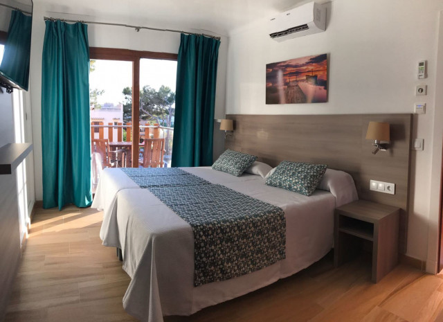 Apartamentos Playa Ferrera - wohnbeispiel schlafraum (Photo 3)